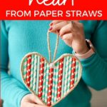 Woman holding paper straw heart
