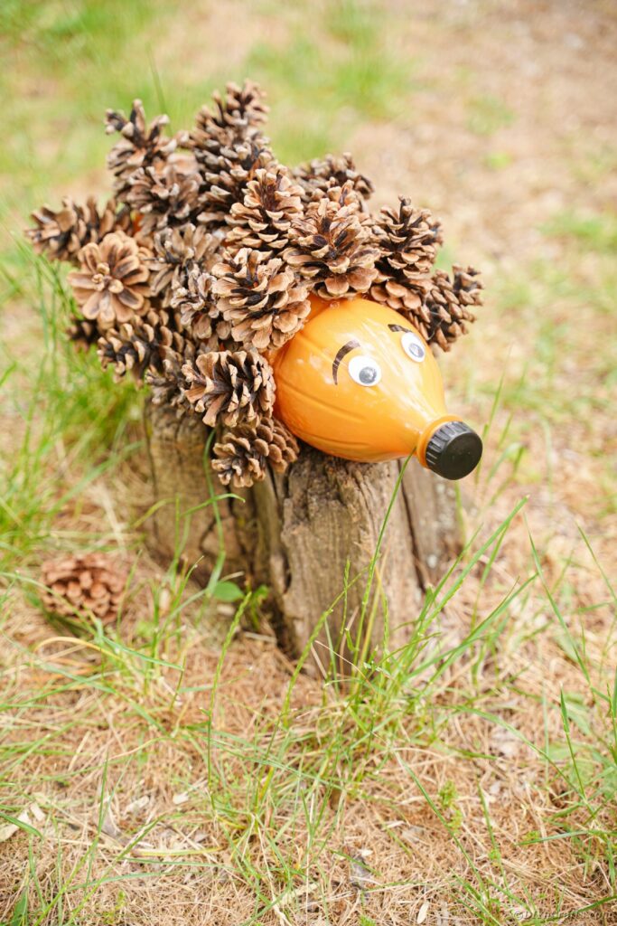 Pinecone hedgehog on a stump