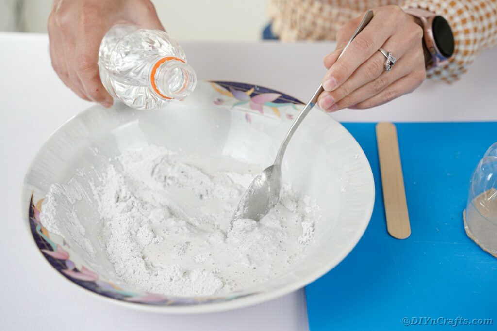 Mixing plaster in bowl