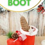 Santa boot on table by wooden board
