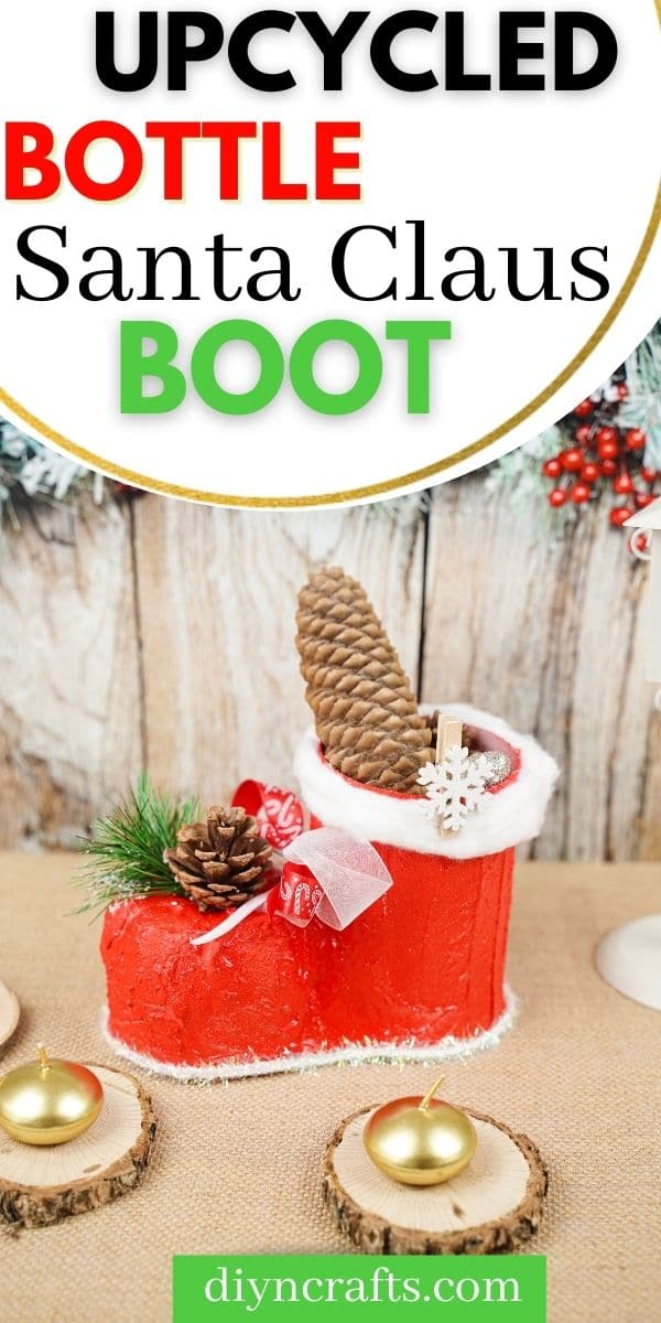 Santa boot on table by wooden board