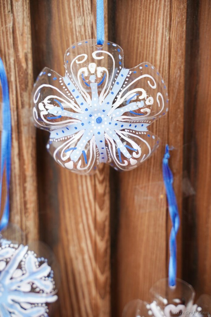 Snowflake ornaments on wooden wall