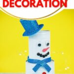 Tin can snowman against yellow background