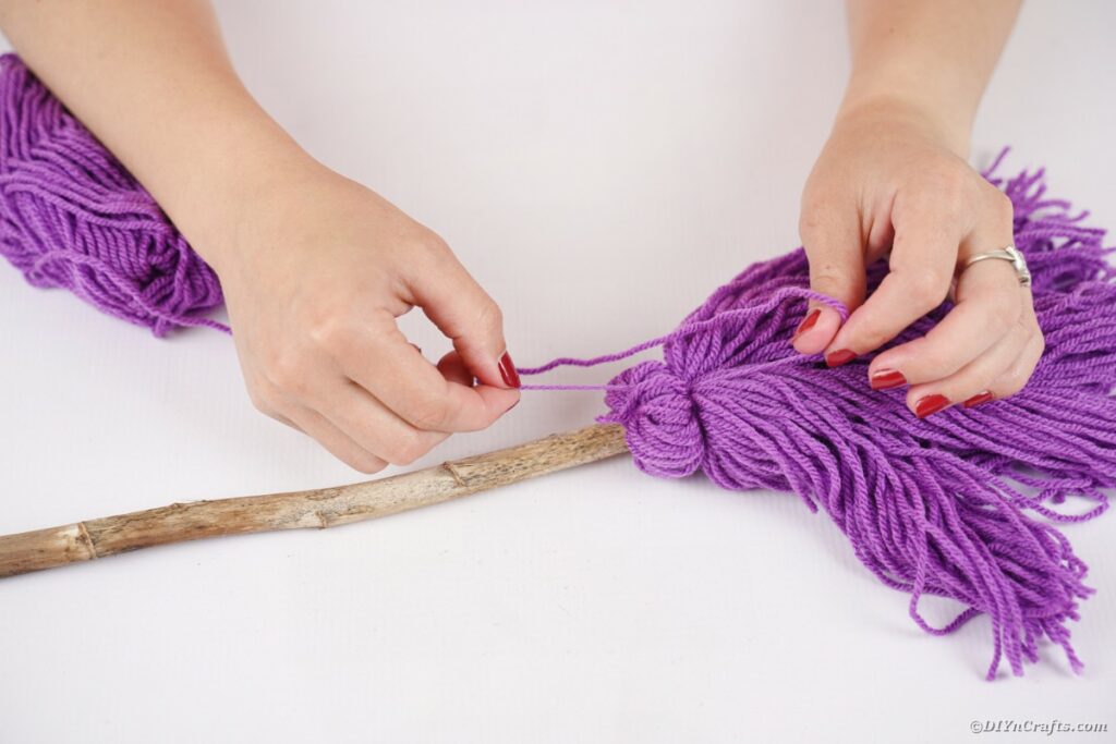 Attaching yarn to broom