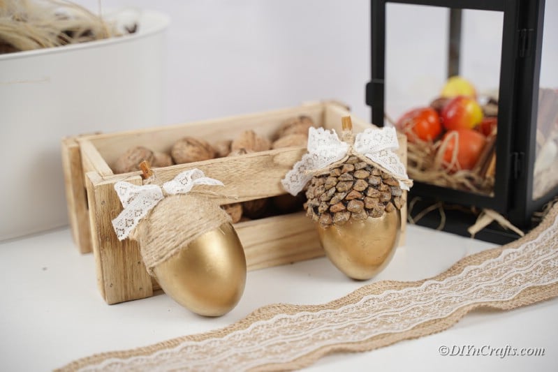 gold acorn crafts on display