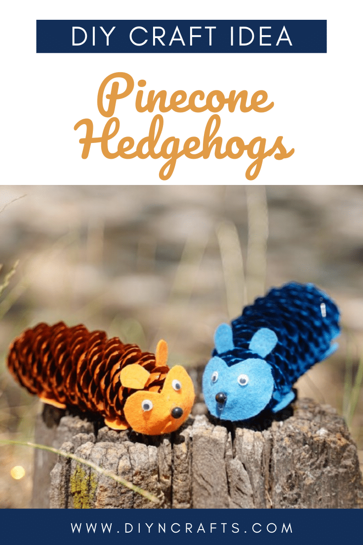 Blue and orange pinecone hedgehogs on stump