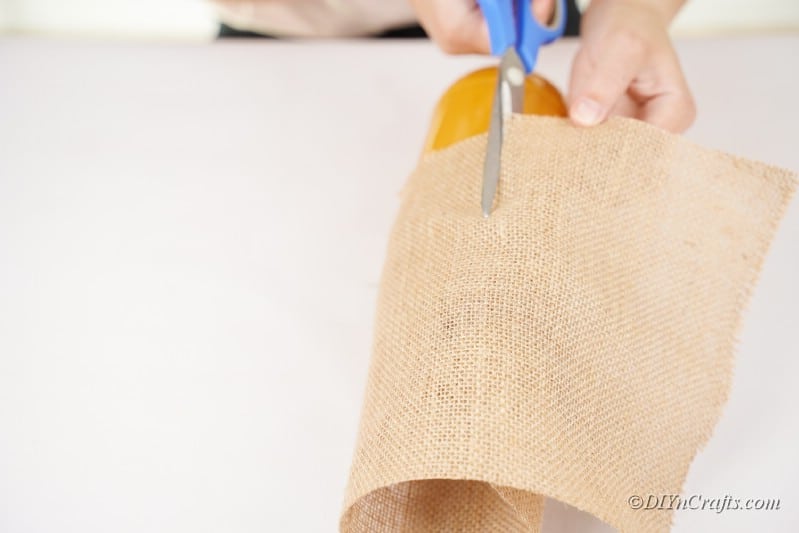 scissors cutting burlap 