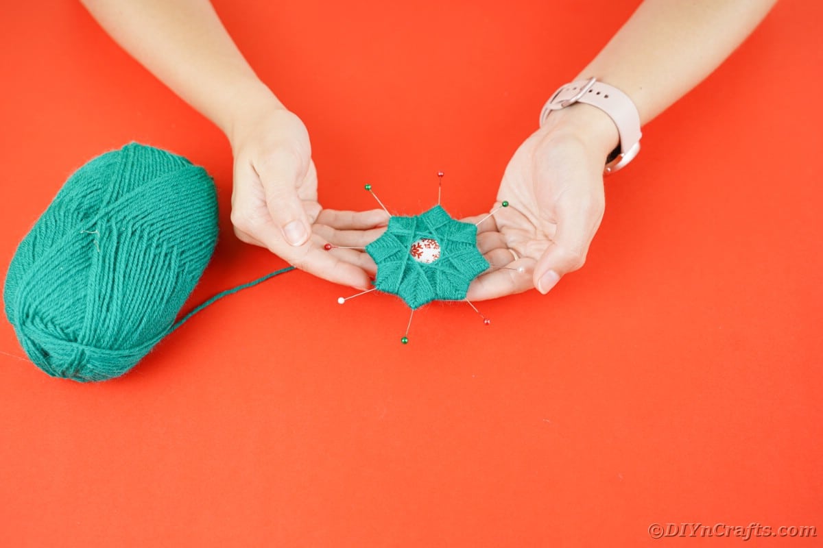 Wrapping yarn around pins