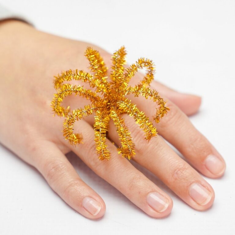 Pipe cleaner ring on womans hand