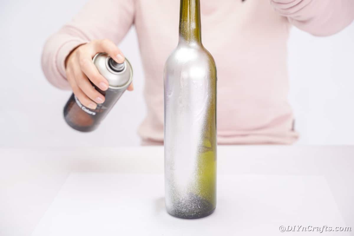 Spraying wine bottle silver
