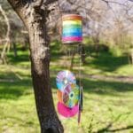 Rainbow wind chime in tree