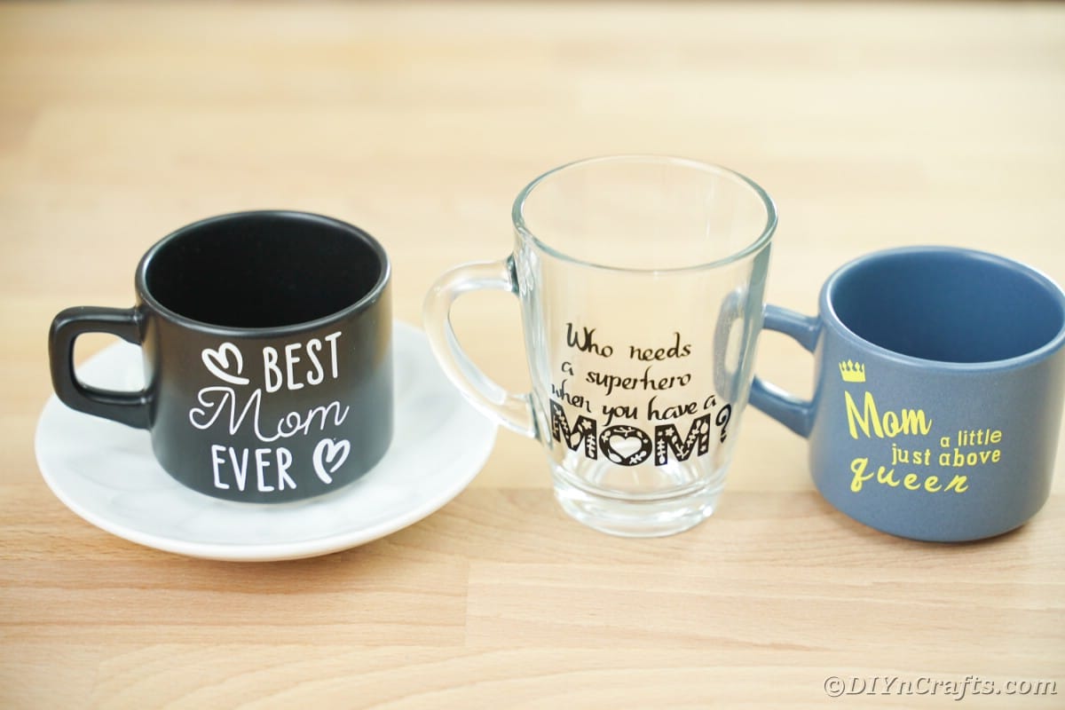 Three Mother's Day mugs on wood table