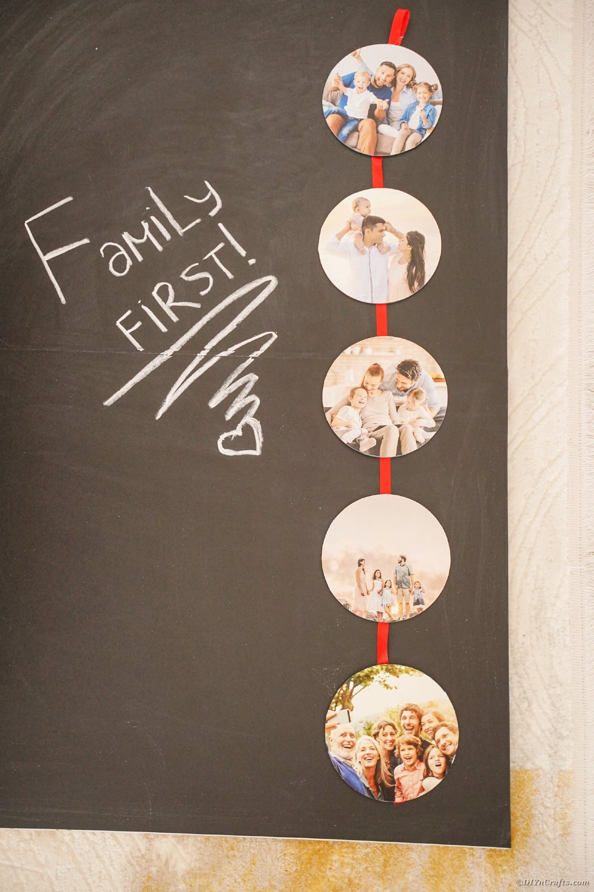 Chalkboard on wall with photo ribbon with red ribbon