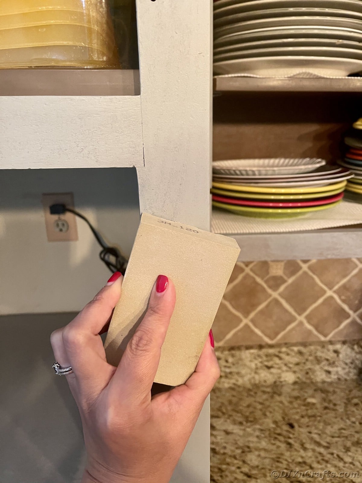 Sanding paint on cabinet bases