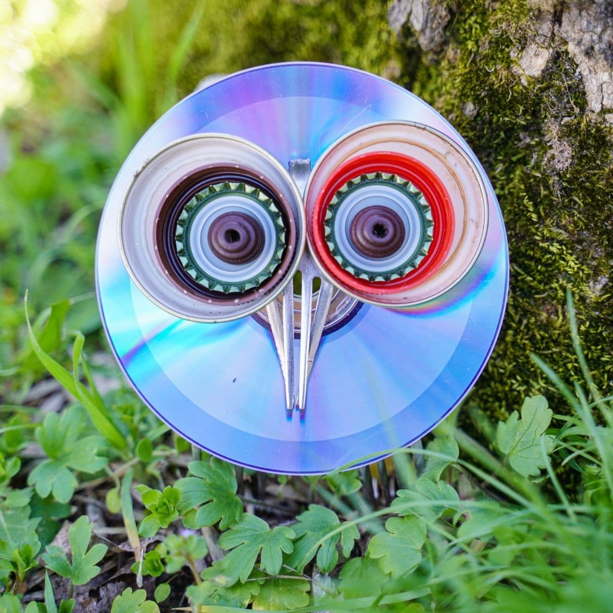 Upcycled CD and fork garden owl by tree