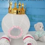 Diaper carriage on white table by blue wall