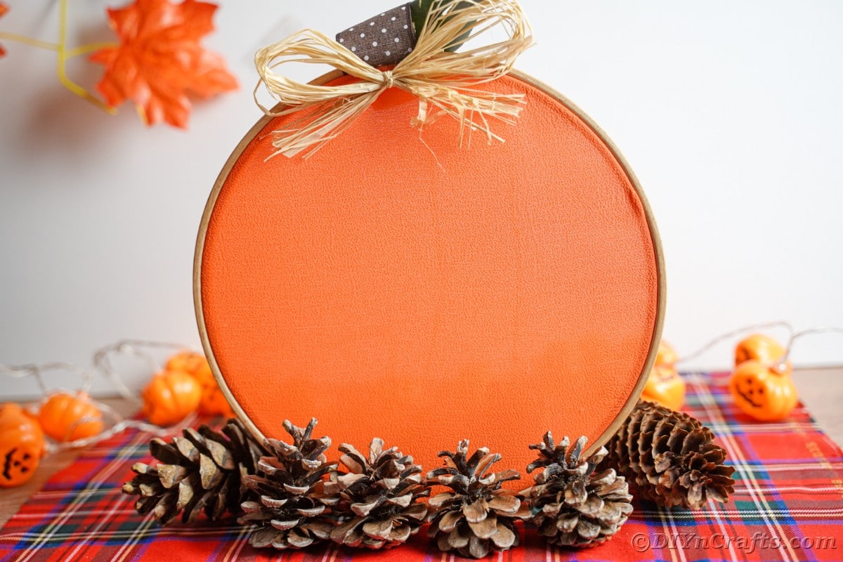 Embroidery hoop pumpkin on red plaid tablecloth