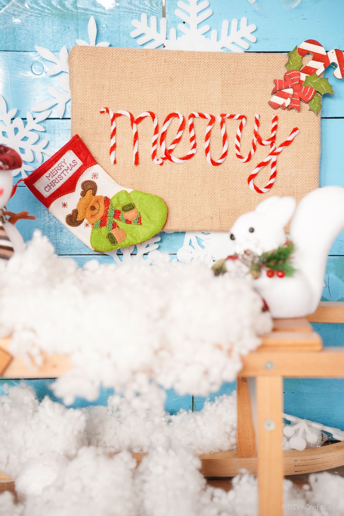 light blue wall with Christmas sign and decor