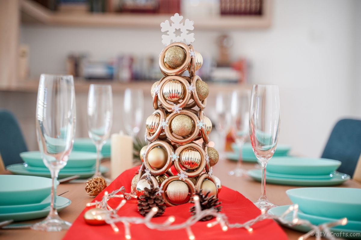 gold ring mini tree on table with
