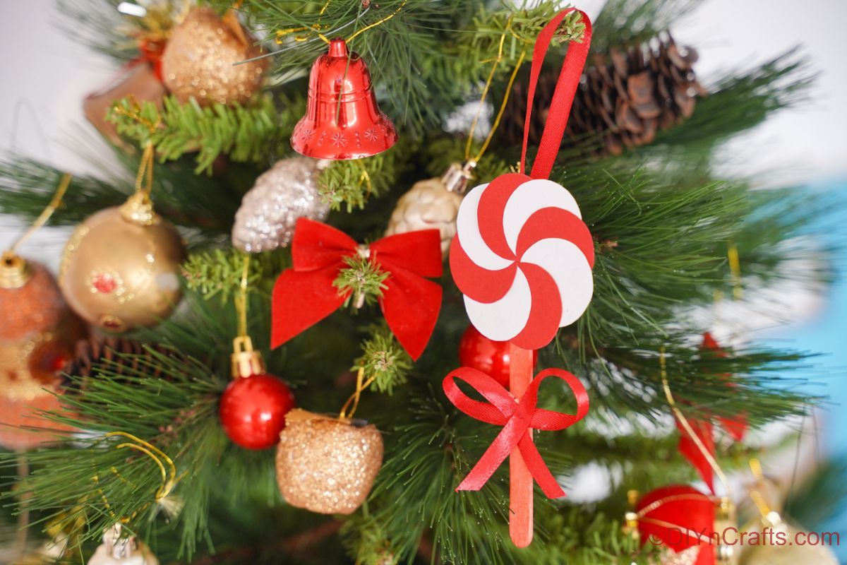 peppermint candy ornament hanging on christmas tree