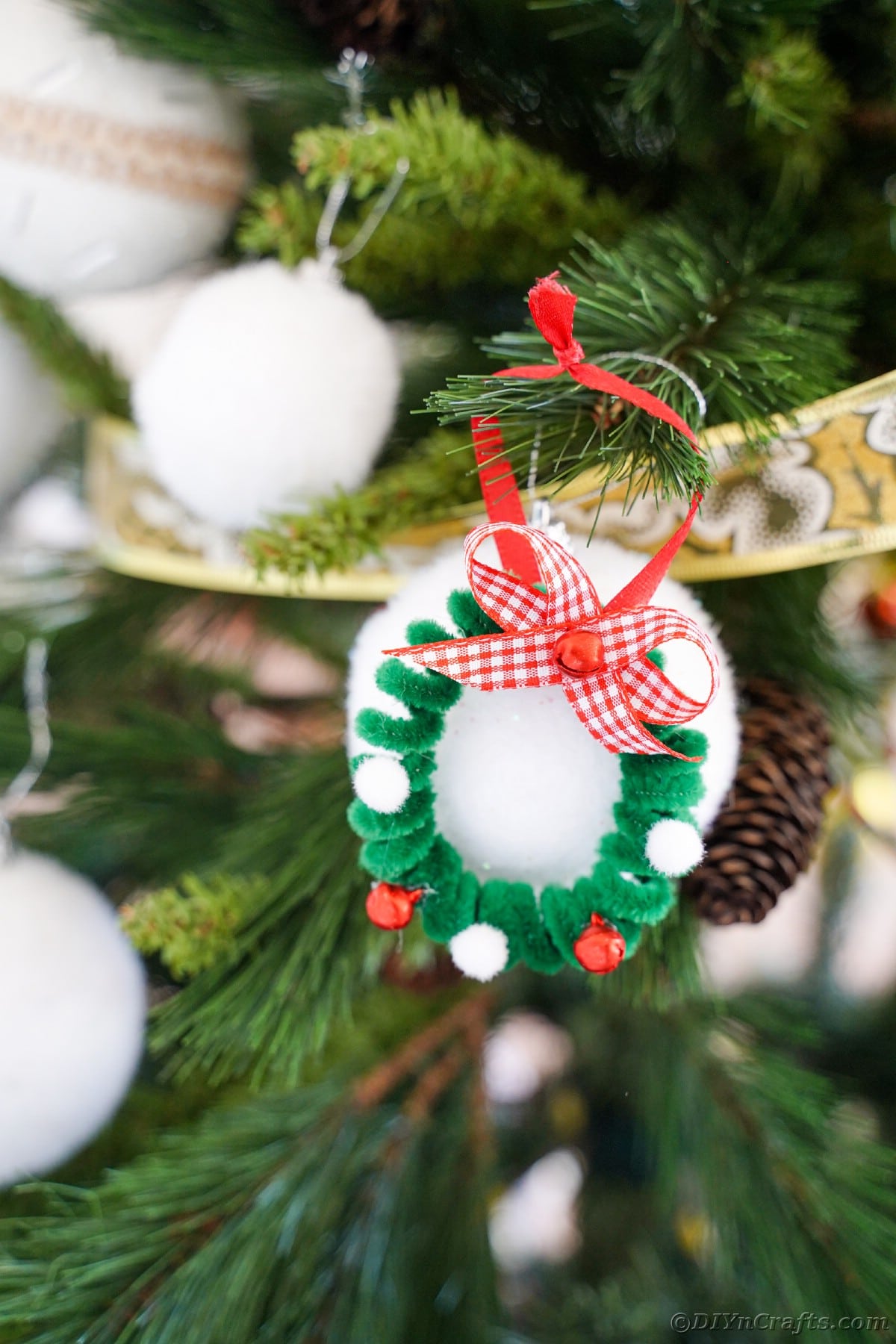 mini pipe cleaner wreath ornament on tree