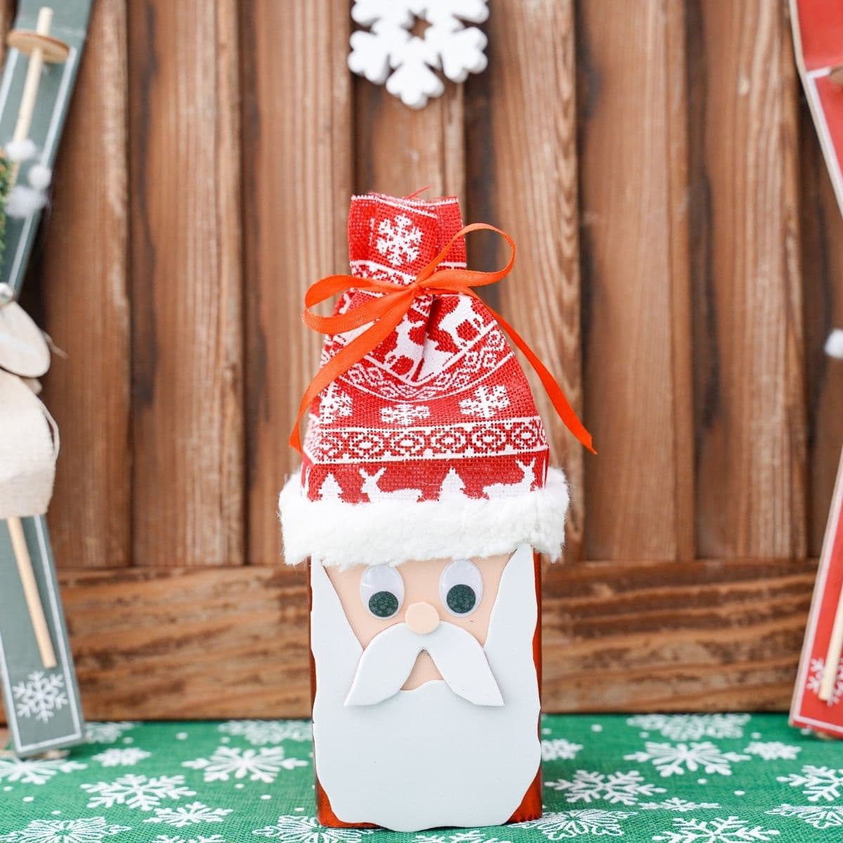 santa claus themed box in front of wood background
