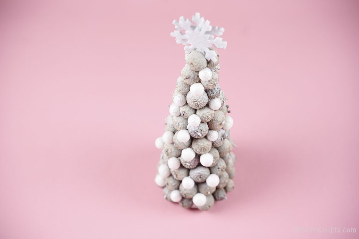 white mini christmas tree on pink table