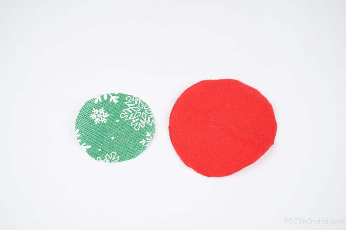 green and red fabric circles on white table