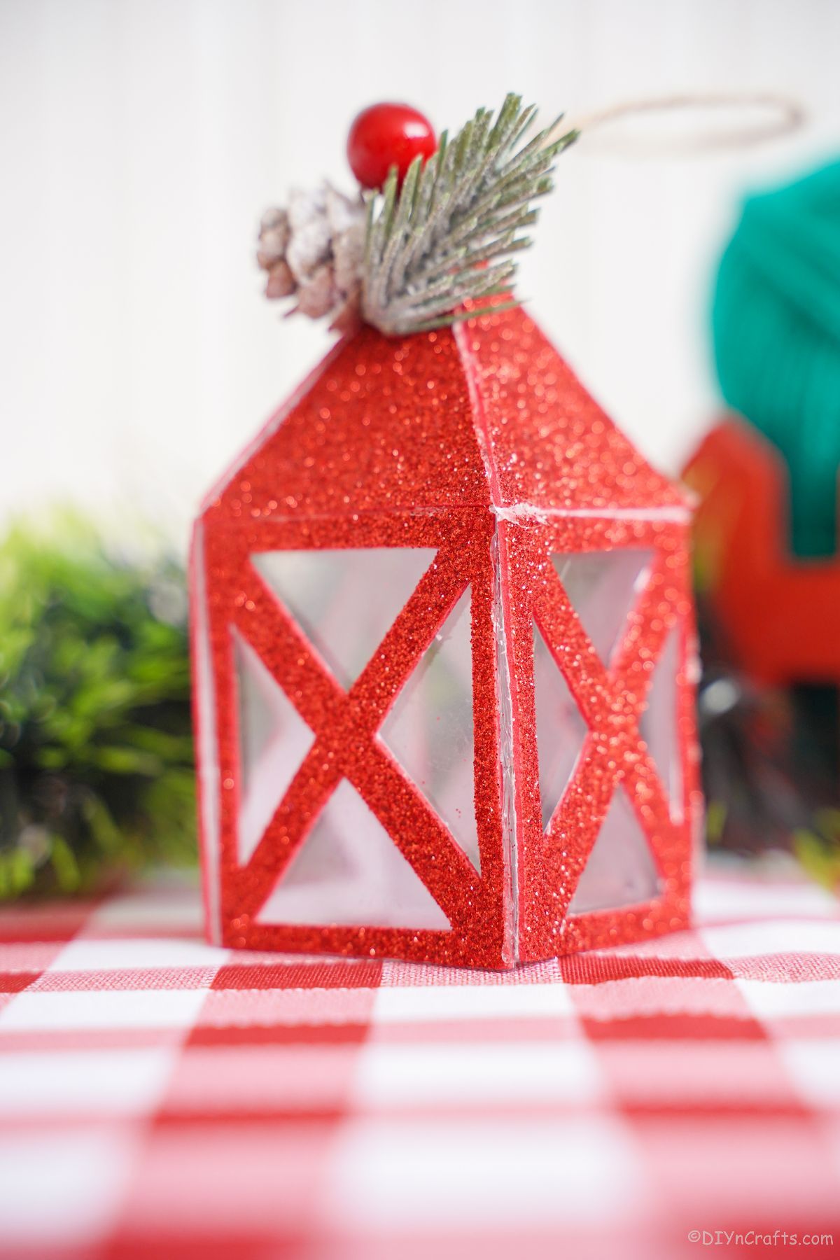 red paper lantern on red checked tablecloth