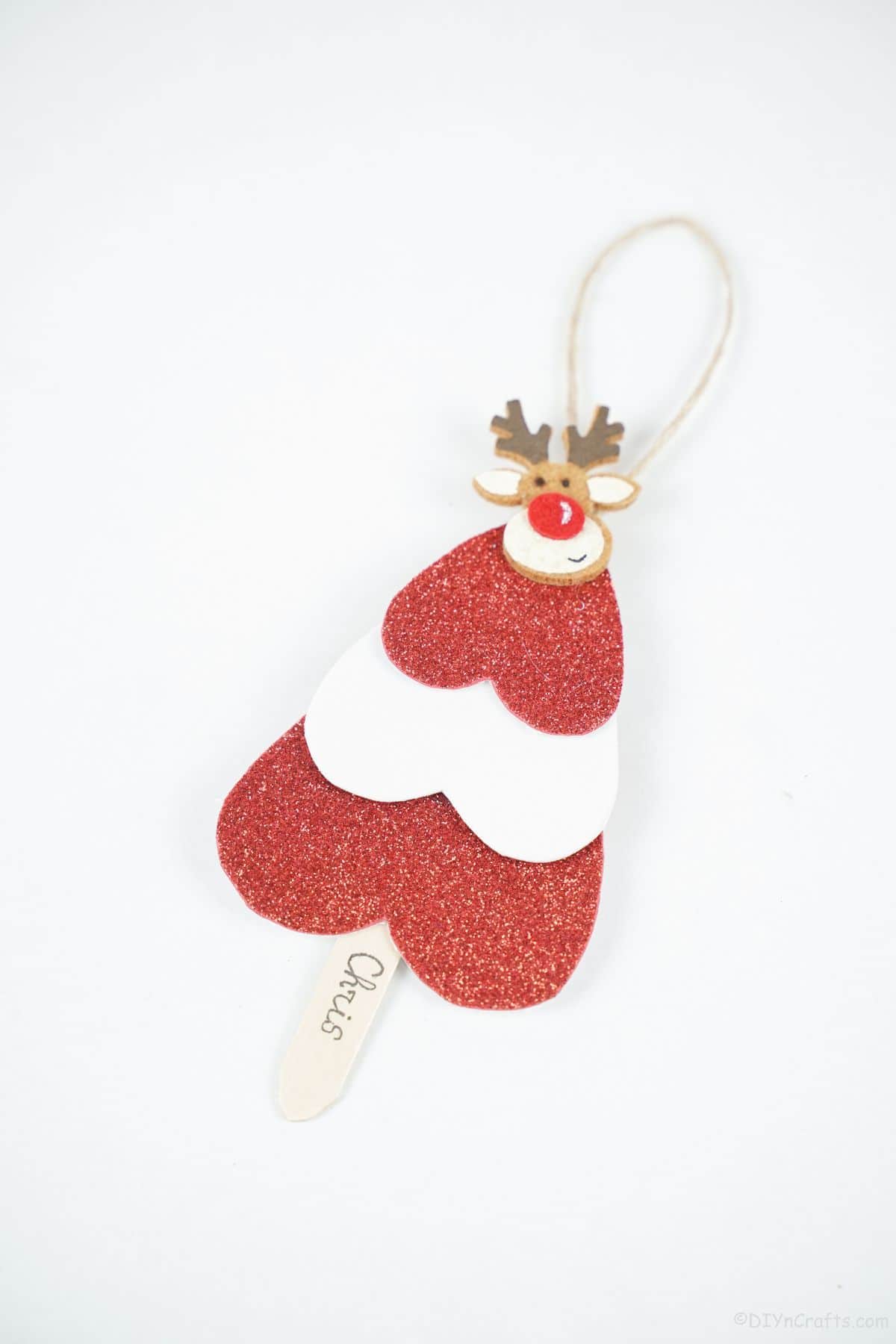 red and white tree ornament on white table