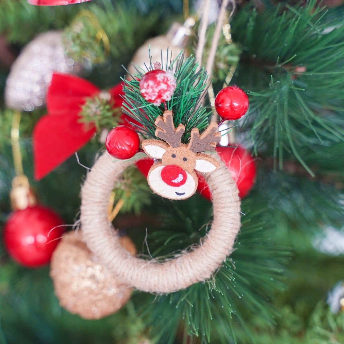 miniature twine wreath ornament on christmas tree