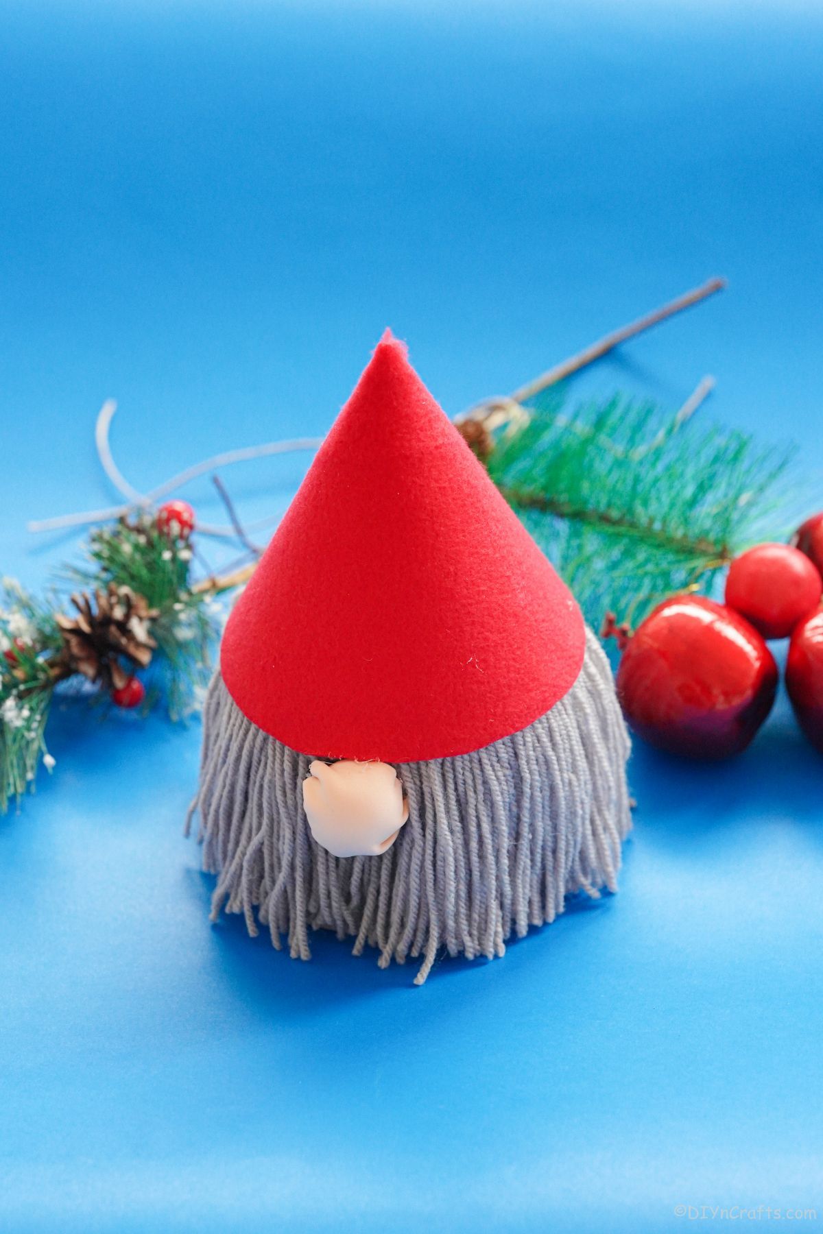 gnome with red hat on blue table