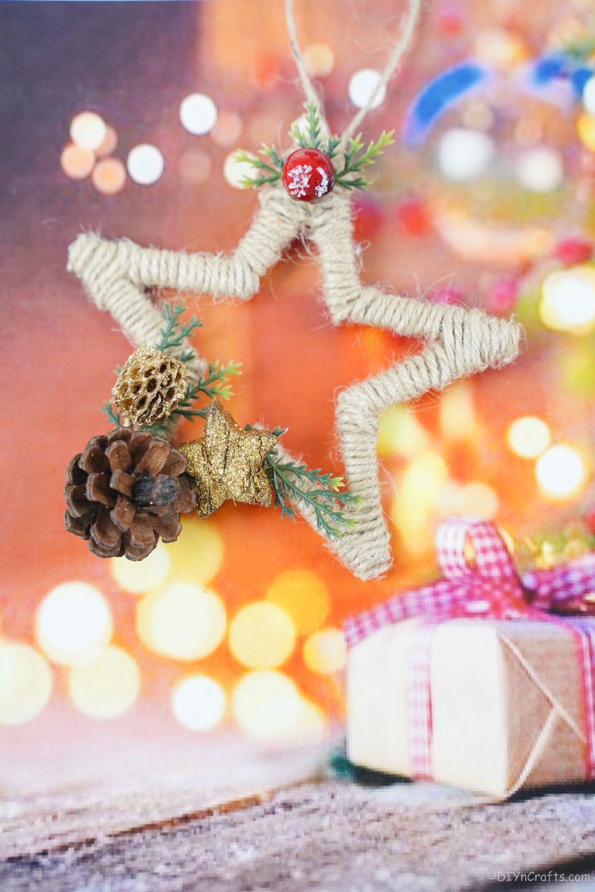 star christmas ornament hanging on fake tree