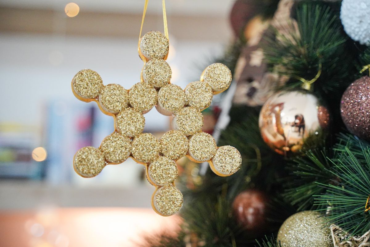 glitter gold snowflake hanging on tree