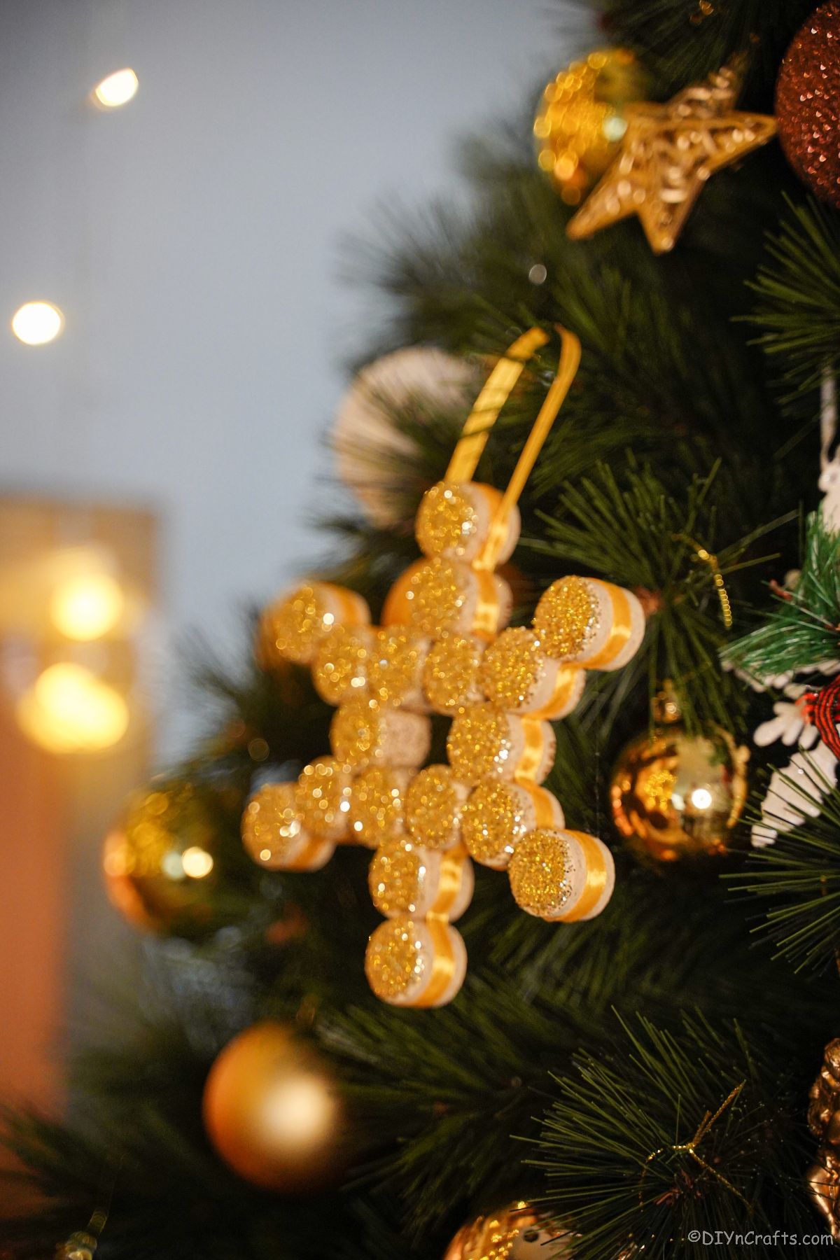 gold snowflake ornament on christmas tree