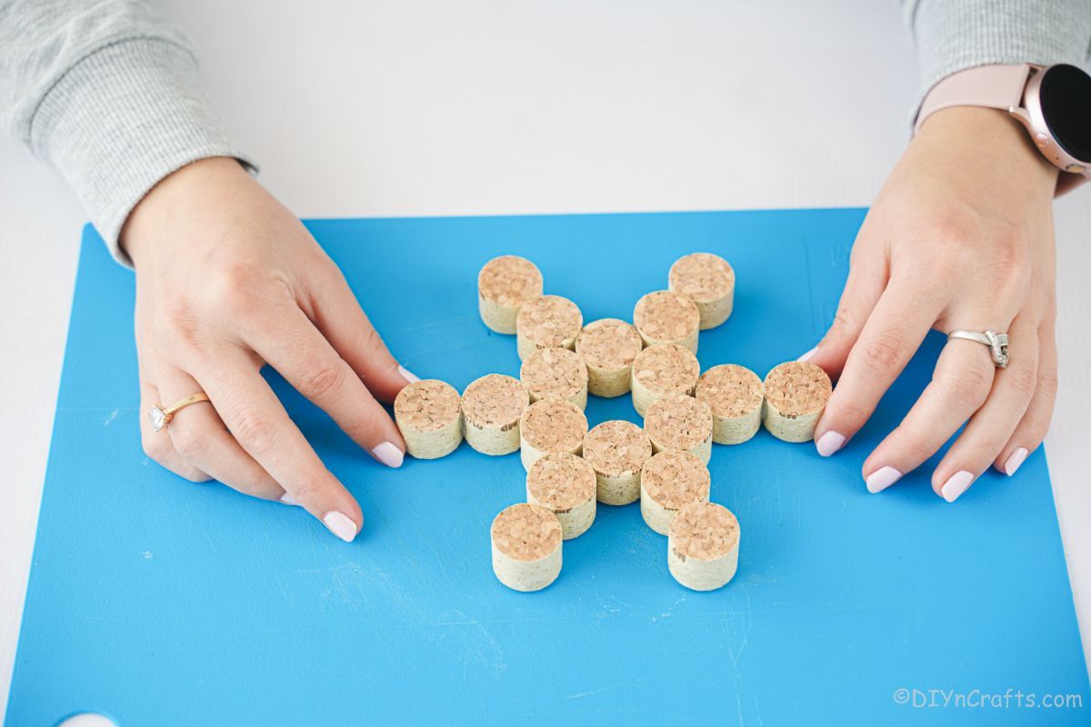 snowflake shaped cork on blue paper