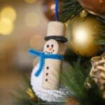 snowman ornament in holiday tree