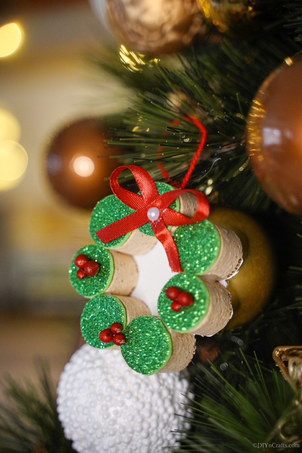 cork wreath with geren front and red bow on tree
