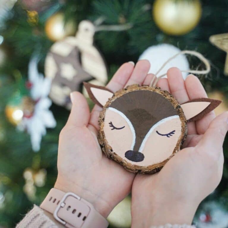 reindeer ornaments in ladies hands