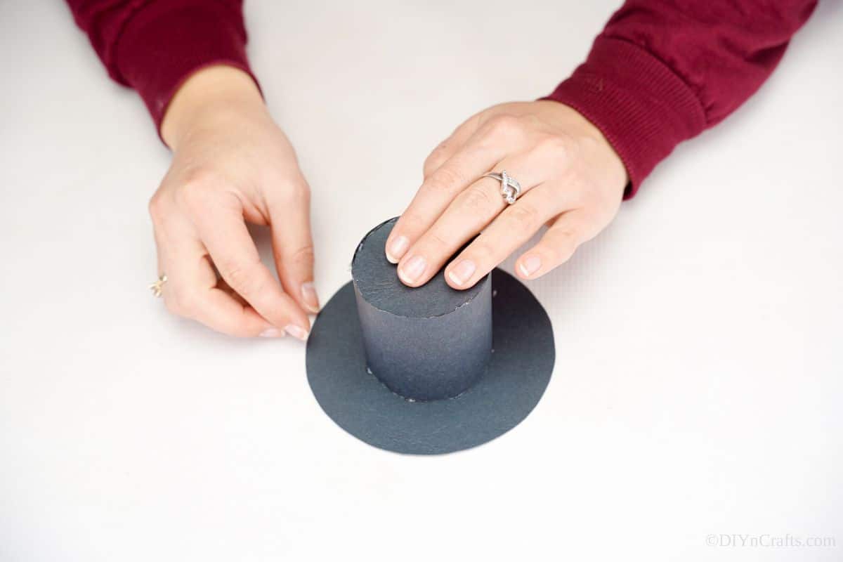 black paper hat on white table