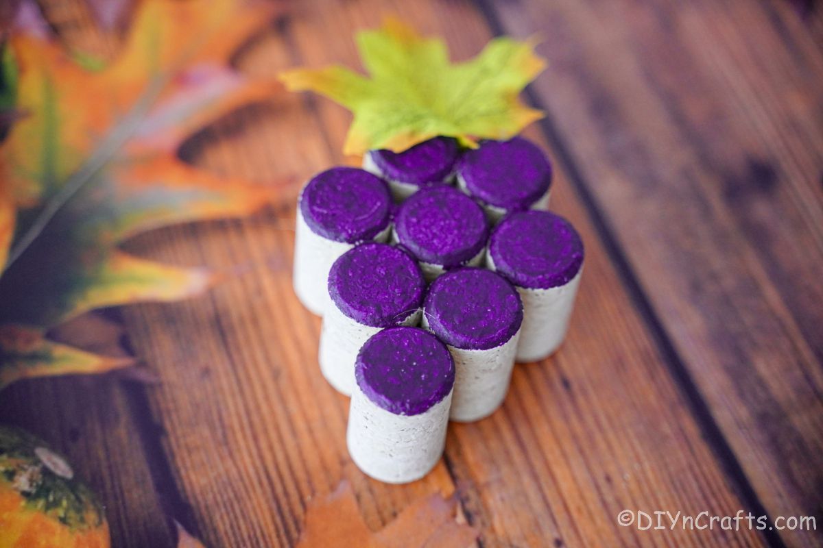 corks made into grape cluster and painted purple on table