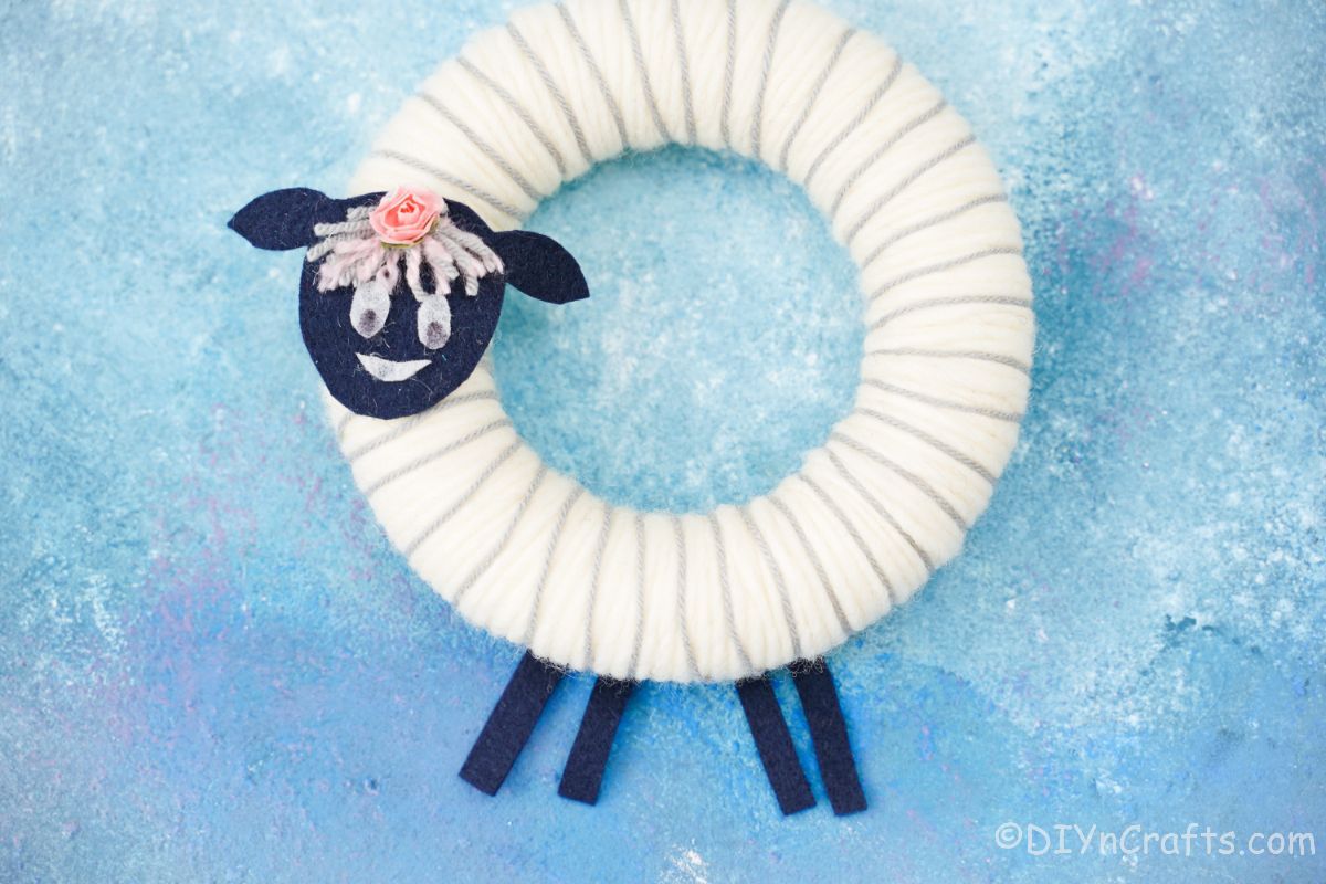 sheep wreath on blue background