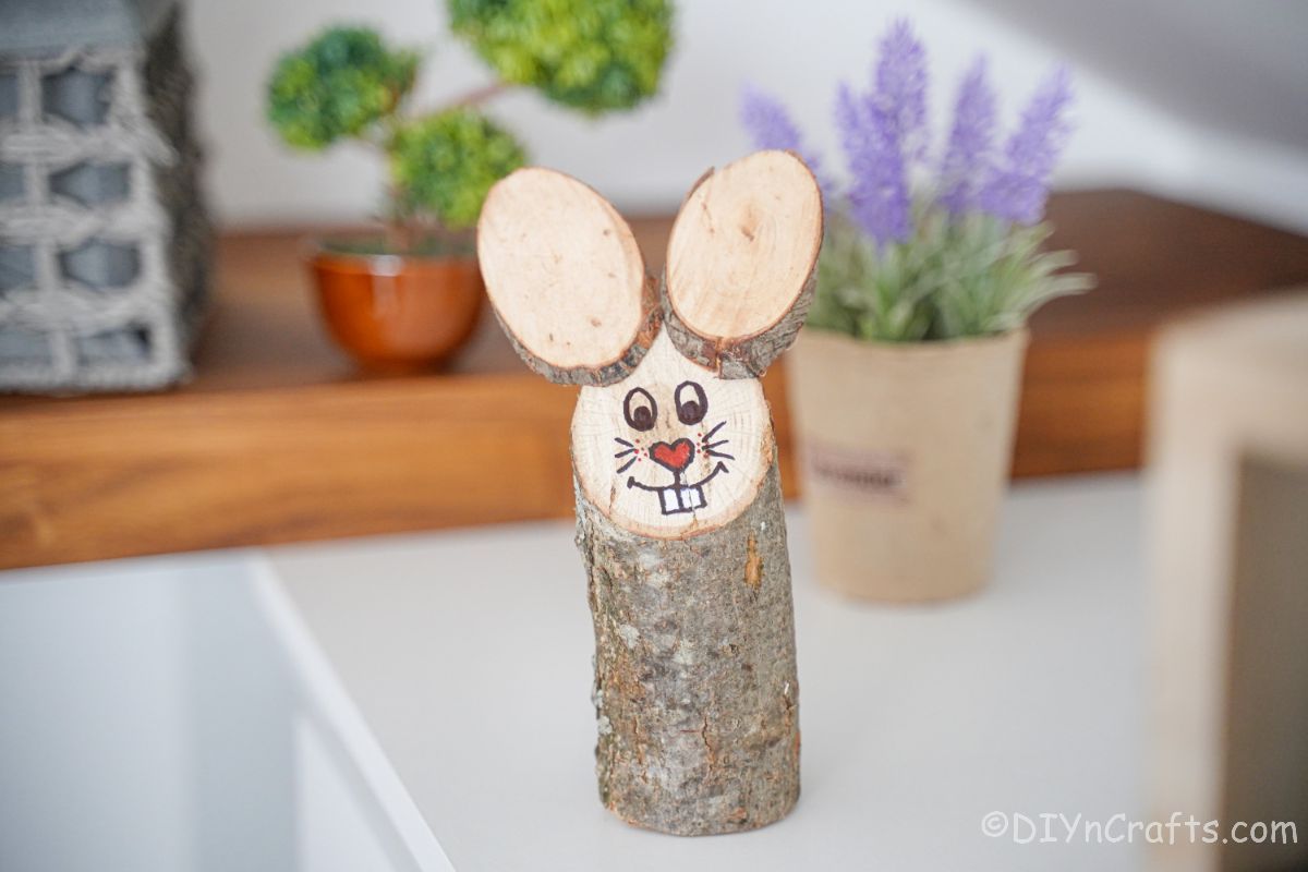 Wood slice bunny on white table