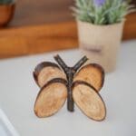 wood butterfly on white table