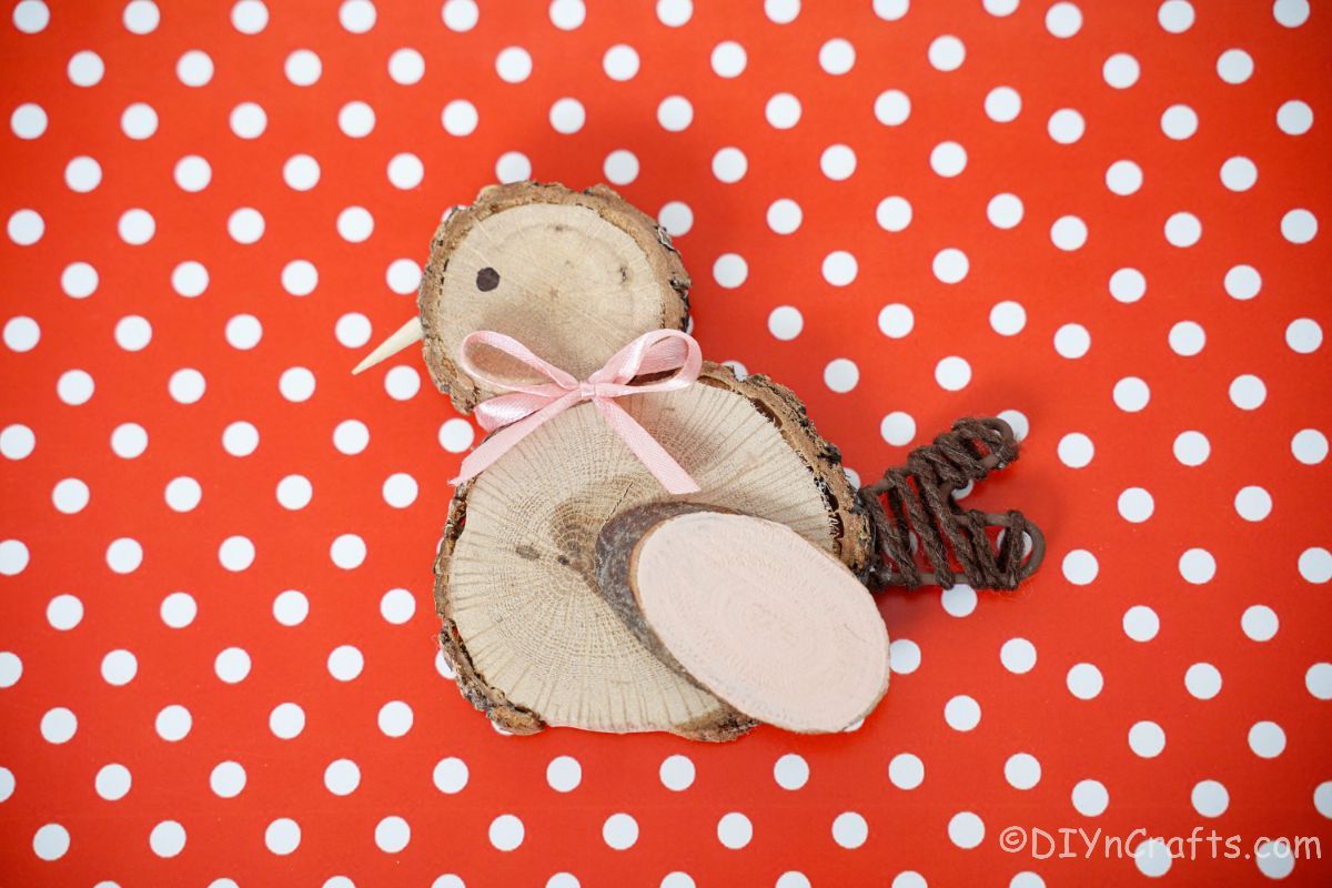 wood slice chick on red and white polka dot paper