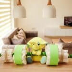 diaper cake barbell with green access on table