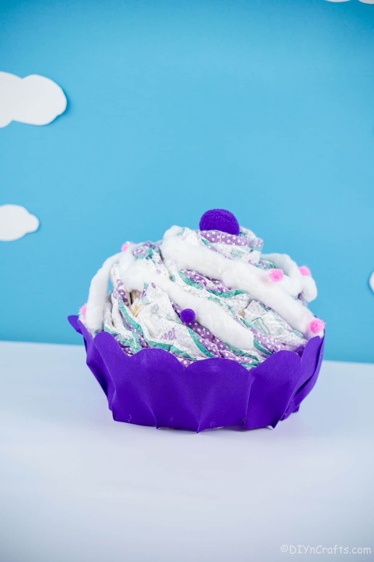cupcake diaper cake in front of blue background
