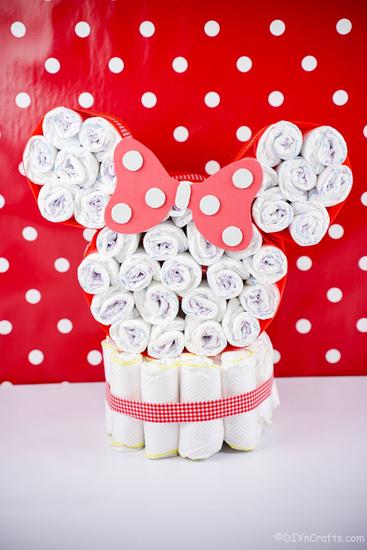 Minnie Mouse diaper cake in front of red and white polka dot wall