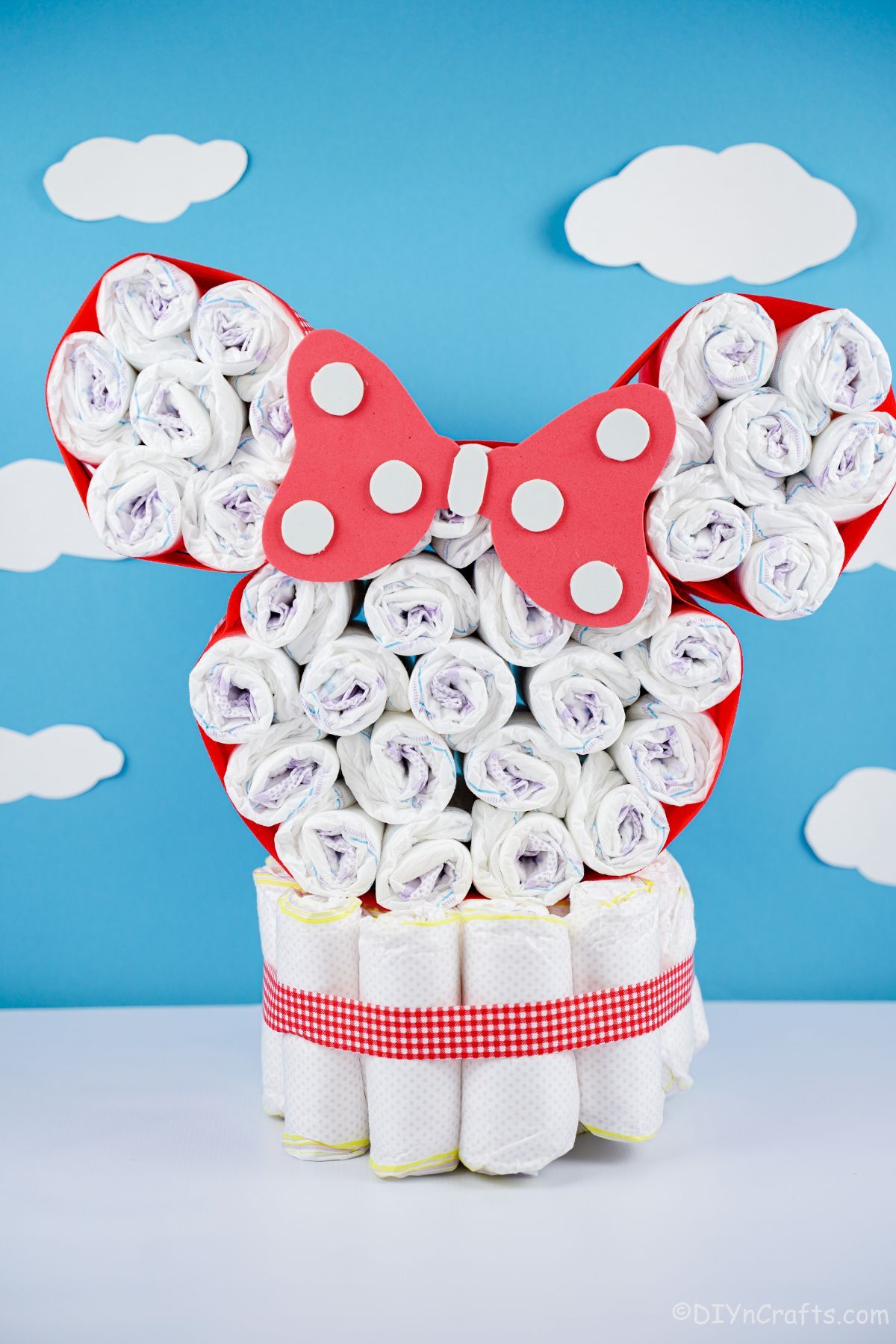 Disney diaper cake in front of white and blue wall
