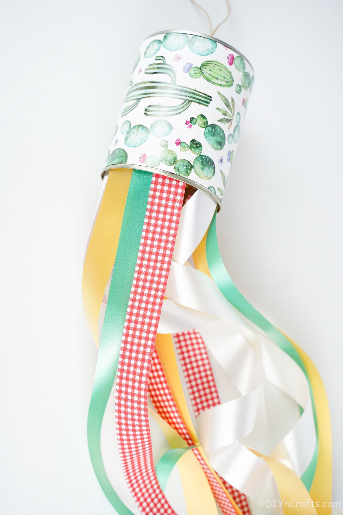 tin windsock on the table with colored ribbons